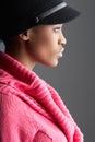 Woman Wearing Cap And Knitwear In Studio