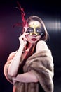 Woman wearing carnival venetian mask on blur background Royalty Free Stock Photo