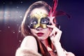 Woman wearing carnival venetian mask on blur background. Royalty Free Stock Photo