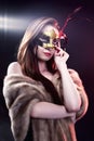 Woman wearing carnival venetian mask on blur background. Royalty Free Stock Photo