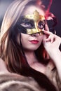 Woman wearing carnival venetian mask on blur background. Royalty Free Stock Photo