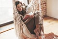 Woman wearing cashmere nightwear relaxing in cabin