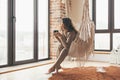 Woman wearing cashmere nightwear relaxing in cabin near fireplace Royalty Free Stock Photo