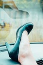 Woman wearing classic leather shoes with foot up Royalty Free Stock Photo
