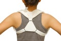 Woman wearing clavicle brace for immobilize shoulder