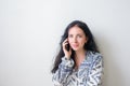 Woman wearing an colore shirt using a mobile phone