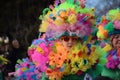 Woman wearing a colorful festive costume in a traditional carnival parade in Deizisau, Germany.