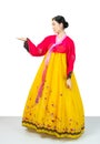 The woman wearing colorful Hanbok, Korean traditional dress on white background isolated.