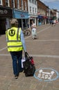 Woman wearing Corvid-19 jacket. Keep distance. Royalty Free Stock Photo