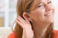 Woman wearing deaf aid Royalty Free Stock Photo