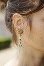 Woman wearing decorative earrings Royalty Free Stock Photo