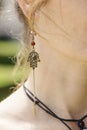 Woman wearing decorative earrings Royalty Free Stock Photo