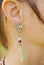 Woman wearing decorative earrings Royalty Free Stock Photo