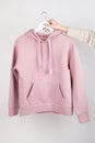 Woman wearing empty pink hoodie in hand, mockup for your own design Royalty Free Stock Photo