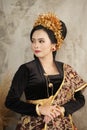 Woman wearing Endek woven fabric and Balinese Kebaya Royalty Free Stock Photo