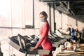 Woman wearing face mask exercise workout in gym during corona virus pandermic Royalty Free Stock Photo