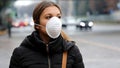 COVID-19 Pandemic Coronavirus Woman in city street wearing face mask protective for spreading of disease virus SARS-CoV-2. Girl wi