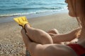 Woman wearing flippers near sea on beach Royalty Free Stock Photo