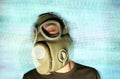 Woman wearing gas mask and headphones