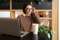 Woman Wearing Glasses using Laptop Royalty Free Stock Photo