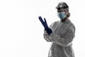 Woman wearing gloves with biohazard chemica protective suit isolated on white background