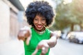 Woman wearing green dress standing in the city Royalty Free Stock Photo