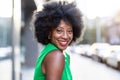 Woman wearing green dress standing in the city Royalty Free Stock Photo