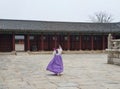 Woman wearing Hanbok traditional Korean clothes in Gyeongbokgung Palace in Seoul, Korea Royalty Free Stock Photo