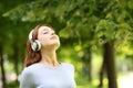 Woman wearing headphones meditating listening audio guide Royalty Free Stock Photo