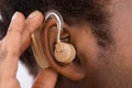 Woman Wearing Hearing Aid In Ear Royalty Free Stock Photo