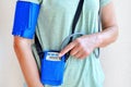 Woman wearing holter monitor device for daily monitoring of an electrocardiogram.