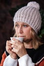 Woman is wearing indoors a knitted cap Royalty Free Stock Photo