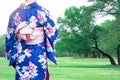 Woman wearing Kimono traditional Japan walking at public park. Royalty Free Stock Photo