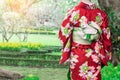 Woman wearing Kimono traditional Japan walking at public park. Royalty Free Stock Photo