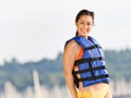 Woman wearing life jacket at beach