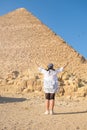 Woman wearing light clothing, facing the Pyramids of Gyza Royalty Free Stock Photo