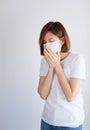 Woman wearing mask get sick from corona virus,, flu symptom as sneezing, cough, fever, body ache, breathing , pain Royalty Free Stock Photo