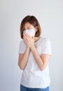 Woman wearing mask get sick from corona virus,, flu symptom as sneezing, cough, fever, body ache, breathing , pain Royalty Free Stock Photo