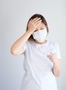 Woman wearing mask get sick from corona virus,, flu symptom as sneezing, cough, fever, body ache, breathing , pain Royalty Free Stock Photo