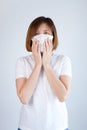 Woman wearing mask get sick from corona virus,, flu symptom as sneezing, cough, fever, body ache, breathing , pain Royalty Free Stock Photo