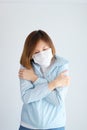 Woman wearing mask get sick from corona virus,, flu symptom as sneezing, cough, fever, body ache, breathing , pain Royalty Free Stock Photo