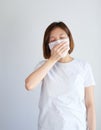 Woman wearing mask get sick from corona virus,, flu symptom as sneezing, cough, fever, body ache, breathing , pain Royalty Free Stock Photo