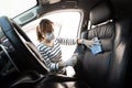 Woman wearing mask,glove,spraying alcohol antiseptic,spray bottle disinfecting,cleaning on backrest,seat in car,safety during Royalty Free Stock Photo