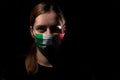 Young Woman wearing mask for protection from corona virus covid-19 with us flag Royalty Free Stock Photo