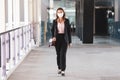 Woman wearing mask waking to work