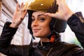 A woman wearing a moto helmet. Royalty Free Stock Photo