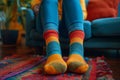 Woman wearing multi colored socks in living room