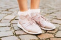 Woman wearing new comfy trainers and soft pink ruffle socks