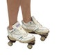 Woman wearing old sport shoes and rusty roller skates,