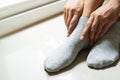 Woman wearing a pair soft grey sock Royalty Free Stock Photo